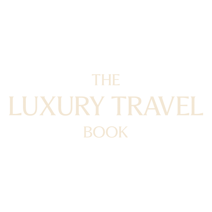 The Luxury Travel Book logo as featured on the Do Not Disturb Guest List